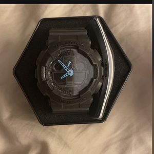 Black G shock with case.